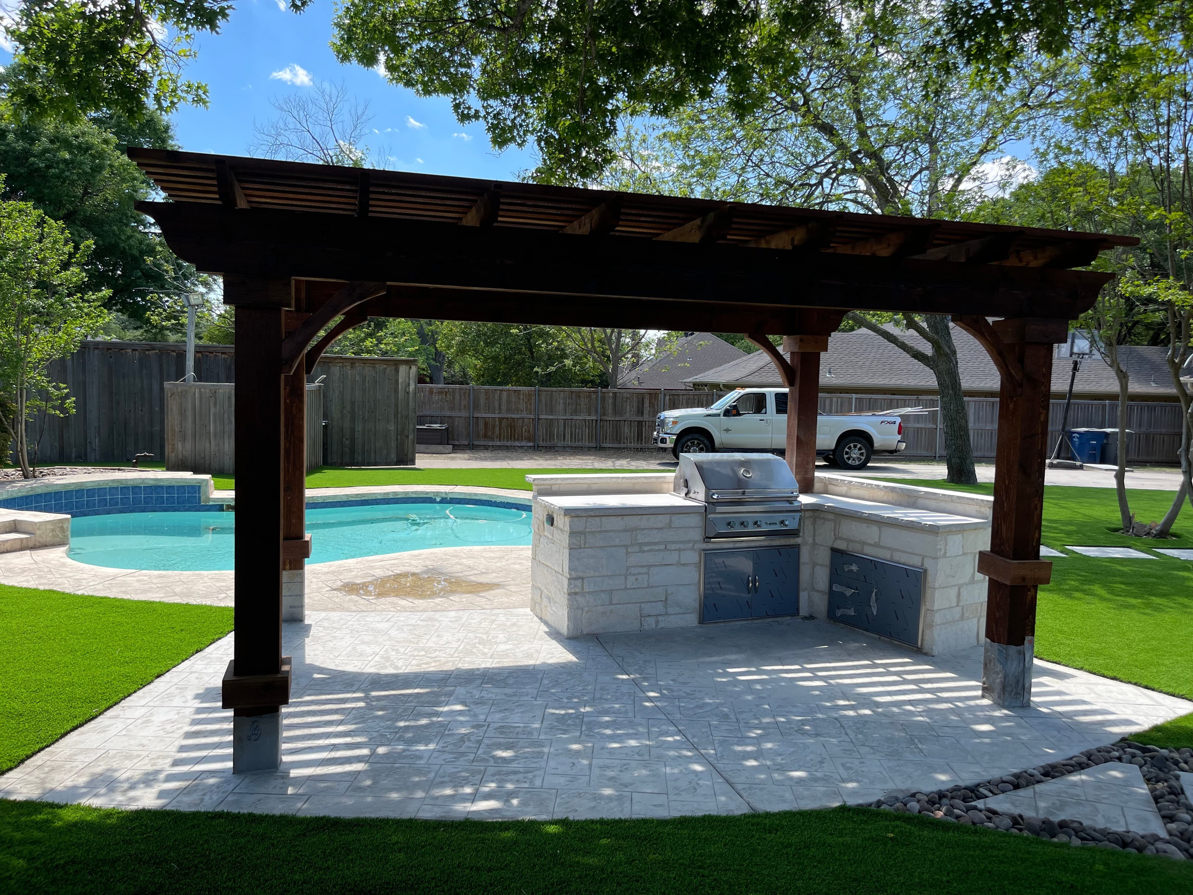 Poolside pergola with outdoor kitchen