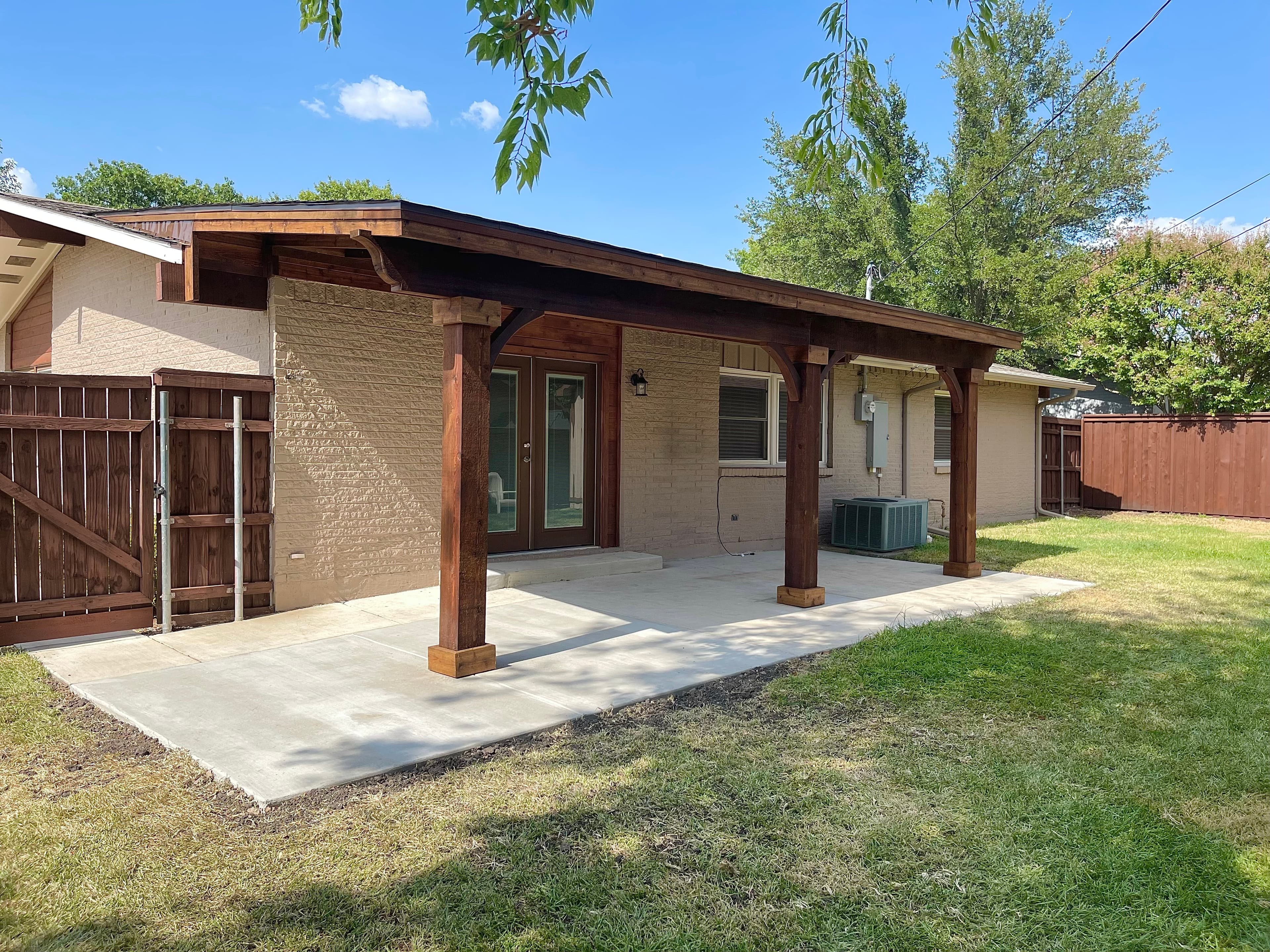 Wooden patio cover attached to home
